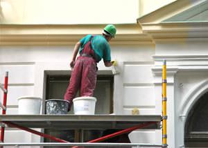 An exterior painter working on a home in Lilburn