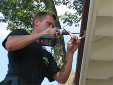 screwing gutter brackets to fascia board